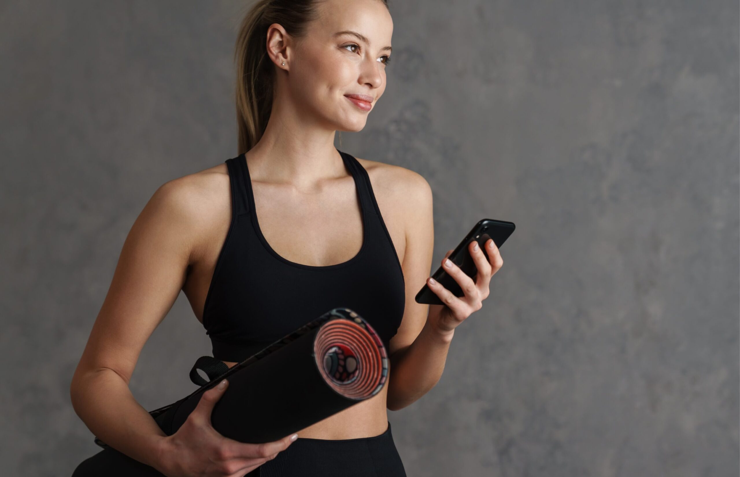 attractive-healthy-young-woman-with-a-fitness-mat-2023-11-27-05-27-08-utc (1)