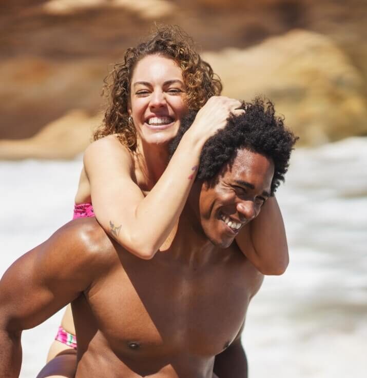 cheerful-woman-holding-on-to-boyfriends-head-while-2023-11-27-04-50-45-utc (1)